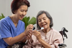 Elderly people brushing their teeth
